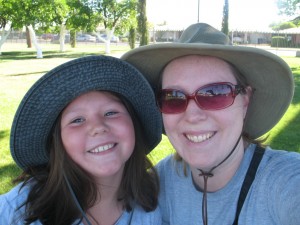 Mom and daughter, smiling together.